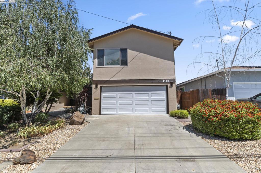 Original Owners - Move-In Ready! Welcome to this beautifully maintained home featuring 2 primary suites, one on the main level & one upstairs. Flexible floorplan includes 3 bedrooms with a possible 4th bedroom, perfect for a home office or guest space. Enjoy brand new carpet and baseboards, fresh interior paint, & a new garage door for added curb appeal. The updated kitchen offers modern style & function, while hardwood floors add warmth & charm. The large upstairs suite provides a private retreat with its own on-suite bath. Two sliding glass doors lead to the backyard patios, creating great indoor-outdoor flow. Located within walking distance to K-12 schools! Just minutes to historic downtown Livermore with a large variety of restaurants with outdoor dining, farmers markets and 2 cinemas! Livermore itself is a treasure trove of amenities, from its premier golf courses & charming downtown to the local general aviation airport & the natural beauty of Del Valle Recreation Area. Immerse yourself in live entertainment, explore a diverse culinary scene, & discover miles of hiking & biking trails. The region is also renowned for its esteemed wineries, breweries, & distilleries. Unique activities like RC airplane flying & a Rod & Gun Club.