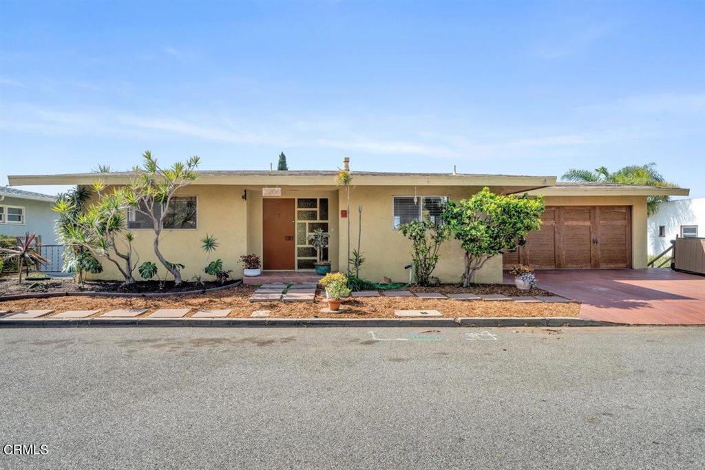 Classic ocean, island & city view as only seen from the hillside above Ventura! Perched high above Ventura HS with a fabulous vista of all 3 sports fields adds a special bonus! 180 degree view from Living Room & upper level deck, both of which run the length of the home! 2 bedrooms plus den & gigantic bonus room downstairs. Pantry & laundry room with gas & 220 also located on the lower level. Handy laundry chute from upper level to laundry room. Wood-burning, raised hearth fireplaces in both the living room & den. Two semi-finished rooms below the garage are accessible from the spacious full-length patio. Ideal for man cave, workshop, studio or?? Generous, fully-fenced yard offers endless possibilities!! Convenient exterior staircase. A true diamond-in-the rough opportunity!!