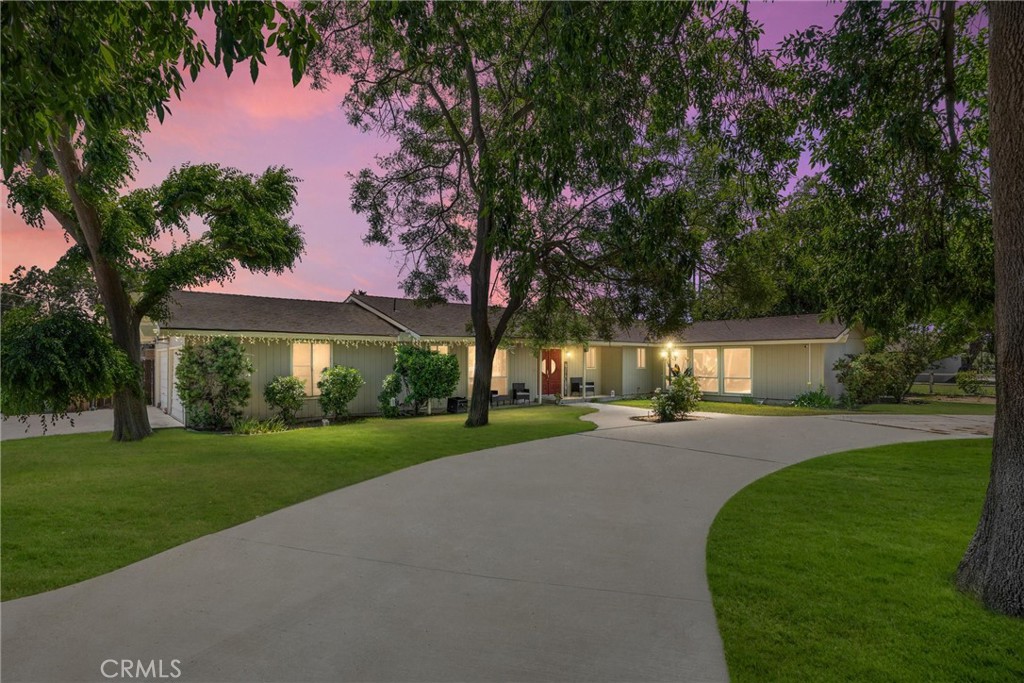 Welcome to Country Living! This unique 4-bedroom, 3-bath home sits on nearly a full acre of usable land, offering the perfect blend of comfort and potential. Inside, you’ll find brand-new flooring throughout, a modern kitchen, and a cozy dining area. With some TLC, this property can truly shine! Step outside to discover small stables, a detached office/studio, and an oversized underground pool ideal for entertaining or relaxing on sunny days. The property also features grape vines, an orange tree, a spacious deep pit, and ample room to add an ADU, making it a wonderful fit for multigenerational living, equestrian enthusiasts, hobby farmers, or anyone who loves outdoor space.