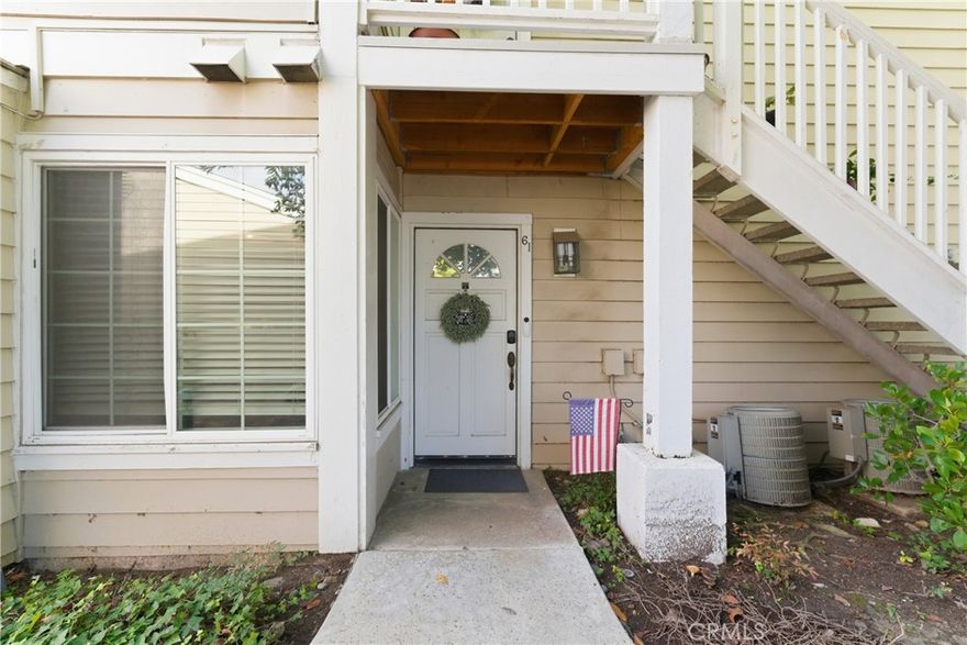 Welcome to Harbor Gate North, a beautifully maintained and securely gated community surrounded by mature pines, eucalyptus, and lush landscaping. This serene enclave features manicured greenery, peaceful walking paths, and a tranquil water feature with cascading rock formations that create a soothing ambiance throughout the grounds.
This charming single-level, ground-floor end unit offers 1 bedroom and 1 bathroom and is filled with natural light throughout. The inviting living area features wood-grain tile flooring, a cozy gas fireplace, and large sliding glass doors that open to an oversized private patio, perfectly framed by mature trees and complemented by the calming sound of the community’s bubbling water feature. The kitchen is equipped with stainless steel appliances, and the property includes a full-size, personal stackable washer and dryer conveniently located next to the bathroom. Additional highlights include a 2-car tandem garage situated in close proximity to the unit for added convenience.
The community is currently completing a $3.2 million HOA-funded renovation project, which includes installation of new roofing, re-lining of exterior water lines, replacement of damaged wood railings, stairs, and balconies, and a complete exterior repainting of all 88 units—adding long-term value and peace of mind for homeowners.