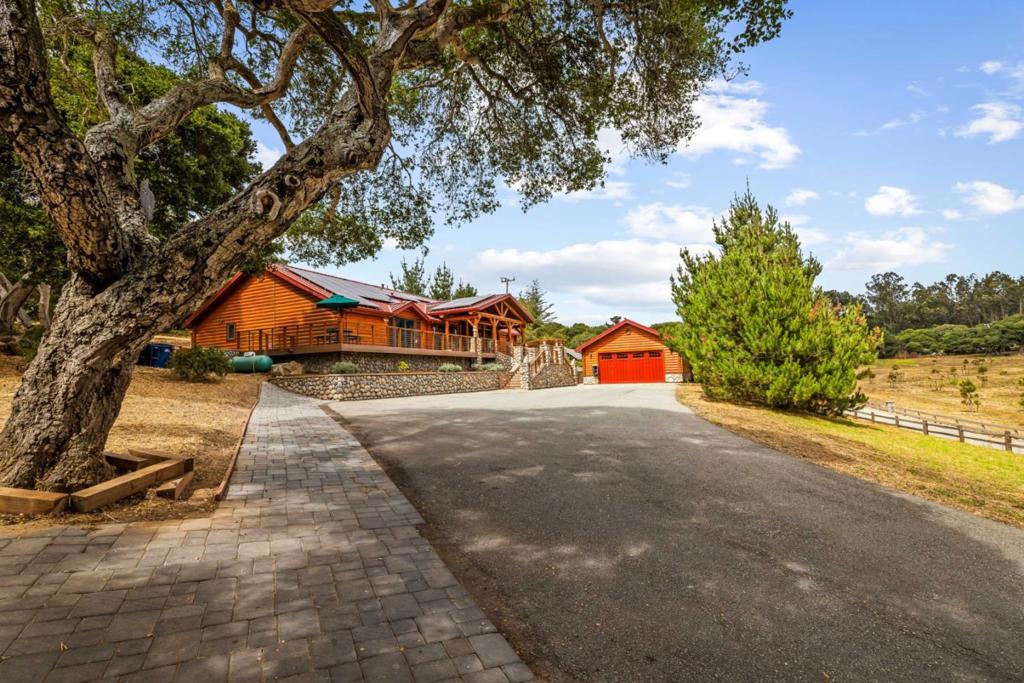 Tahoe-Inspired Ranch Retreat in North Monterey County Where Luxury Meets Privacy. Nestled on 4.3 private, gated acres at the crossroads of Highway 101 and Highway 156 providing effortless access to Monterey, Carmel, Pebble Beach, and the stunning California coastline. This 3,500 sqft custom masterpiece blends rustic elegance with modern amenities. The main residence features two expansive primary suites, each designed for comfort and privacy, with rich hickory wood floors and cabinets, handmade copper sinks, and artisan stone fireplaces that create a warm and timeless ambiance. No detail has been overlooked in this beautifully curated home. An additional detached casita offers flexibility for guests, multigenerational living, or a private studio space. Enjoy the outdoors year-round with your solar-heated pool and house, and multiple patios ideal for entertaining. The home is equipped with a standing-seam metal roof, owned solar system, and its own backup generator, offering both sustainability and peace of mind. A private well ensures abundant water, and RV hookups for two vehicles make hosting or traveling easy.