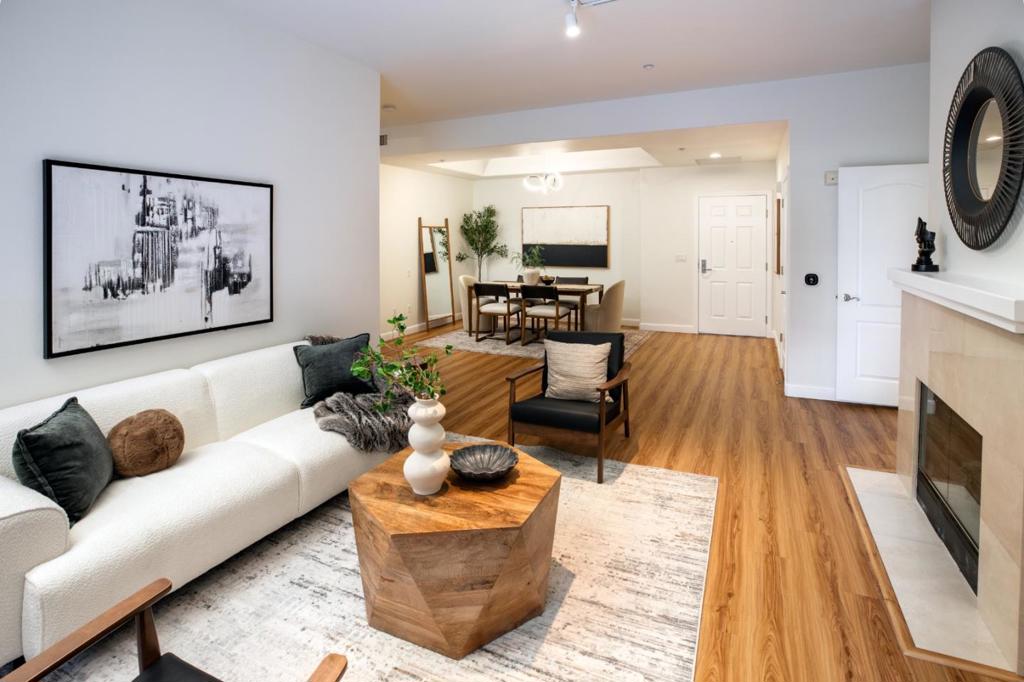 Live in style in the heart of downtown San Jose at Paseo Villas! This stunning 2-bed, 2-bath condo offers 1,662 sq ft of open, sun-filled space with soaring ceilings, wood-grain floors, and expansive glass sliders. Two private master suites each feature walk-in closets and updated en-suite baths. The sleek galley kitchen has solid-surface counters and modern appliances, perfect for home chefs. Enjoy coffee in the breakfast nook or step onto your spacious terrace overlooking the sparkling pool ideal for relaxing afternoons or lively gatherings. Stay comfortable year-round with central AC and the convenience of an in-unit washer/dryer. Resort-style amenities include a gym, saunas, pool, spa, community room, landscaped courtyards, secure mailroom, private storage, and two gated parking spaces. Walk to dining, shops, and entertainment, or commute with ease to nearby Adobe, Zoom, San Jose State, The Tech Interactive, Cohesity, and the expanding Supermicro campus. A rare combination of location, space, and amenities don't miss this one!