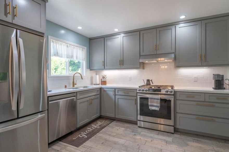 Nestled in a tranquil cul-de-sac in Carmel's coveted Mission Fields neighborhood, 3610 Oliver Road is a beautifully renovated split level home offering timeless charm and modern comfort. Walk to Carmel River Elementary, in the Carmel Unified District! This 3-bedroom, 2-bathroom residence spans 1,629 square feet of natural light on an oversized 6,800 sq ft lot. The living room features dual seating areas, newly finished coastal hardwood floors & a cozy fireplace, connecting to a refreshed backyard with turf, Trex deck, one meyer lemon and two avocado trees. The kitchen showcases custom cabinetry, Caesarstone countertops and energy-efficient appliances. Upstairs, you'll find two bedrooms with high beamed ceilings, a custom luxurious shower with Mediterranean tile and lush views. Extra storage in the stand-up crawl space and deep closets. Recent upgrades: new appliances, paint, double-paned windows, black-out shades, a 96% efficient furnace, a HE water heater with recirculating pump, updated plumbing, electrical, surface drain and roof. Located less than 1.5 miles from Carmel's white sandy beaches and downtown, you'll get privacy and convenience. With a 2-car garage, an EV charger, a fenced backyard and extra water credits for another half bath expansion, welcome to your new home!