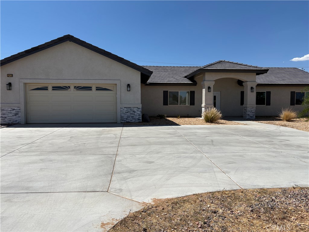 Newly Built Charming Ranch-Style Home in the High Desert - Modern Upgrades Throughout Home.
Welcome to this spacious 4-bedroom, 3-bathroom ranch-style home, perfectly designed for both comfort and convenience. A long paved driveway leads you to the two-car garage, setting the tone for the privacy and charm this property offers.
Inside, you’ll find a cozy living room with a fireplace, a dedicated dining area, and a beautiful kitchen complete with quartz countertops, a walk-in pantry, and a breakfast nook. The primary suite is thoughtfully separated from the other bedrooms for added privacy. It features a carpeted bedroom, a private bathroom with double sinks, quartz countertops, a soaking tub, a separate shower, and a private toilet room.
Down the hall are three additional bedrooms, each with plush grey carpet. Two bedrooms share a full hallway bathroom with dual sinks and a tub/shower combo, while the third bedroom enjoys its own private bathroom with a walk-in shower. and soaking tub. A separate laundry room completes the home’s practical layout.
This home offers both charm and function—ready for you to enjoy desert living at its best. Move in Ready NOW.
Schedule your tour today!