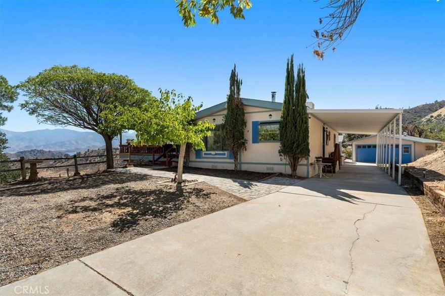 Located in the gated community of Juniper Highlands in Wofford Heights, this property offers panoramic lake and mountain views in the Kern River Valley. Set on 1.6 acres, the home features a spacious living room with fireplace, 2 bedrooms, 2 bathrooms, a mudroom, hardwood floors, and a kitchen with dining area. Recent upgrades include fresh interior paint, new light fixtures, new toilets, and multiple repairs, making it truly move-in ready. Despite these improvements, the property is now offered at a substantially reduced price. Additional amenities include a 2-car garage, covered carport, workshop, and storage shedboth on permanent foundations with potential for conversion into a mother-in-law unit or ADU. A covered porch/patio completes the picture, offering privacy and stunning natural surroundings.