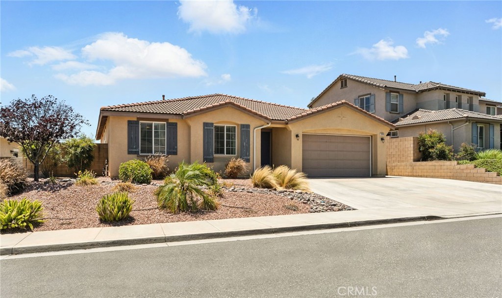 Fall in Love with This Rare Single-Story Beauty in Rolling Hills!
Welcome to the home you’ve been waiting for—where style, comfort, and convenience come together in one extraordinary package. Located in the highly sought-after Rolling Hills community, this rare single-story stunner, built in 2010, offers the perfect blend of modern upgrades and timeless charm.
From the moment you step inside, you’ll feel it: this is home. The open-concept layout is bright and welcoming, with rich laminate wood flooring guiding you from the entryway through the kitchen and hallway. At the heart of it all is a chef-inspired kitchen—featuring stainless steel appliances, granite countertops, a spacious island, and a custom baker’s pantry. Whether you’re whipping up a weeknight meal or hosting a holiday gathering, this space is designed to impress.
The kitchen flows effortlessly into the dining area and expansive great room, creating the ideal setting for connection, comfort, and celebration. When it’s time to unwind, retreat to your private primary suite—your own sanctuary complete with a walk-in closet, dual sinks, a step-in shower, and a spa-worthy oversized soaking tub.
On the opposite side of the home, two additional bedrooms provide flexibility for guests, kids, or a home office—including one with a built-in desk space, perfect for remote work or study. A full second bathroom, large linen closet, and thoughtfully designed laundry room with upper cabinets and side counter add even more convenience to your daily routine.
Step outside and discover your private backyard oasis—lush green lawn, colorful flower beds, and stamped concrete patio, all maintained by an automated drip system. The low-maintenance front yard and extended driveway add curb appeal and practicality. And don’t miss the garage with its custom overhead storage—keeping your space organized and clutter-free.
Tucked away in a peaceful neighborhood yet just minutes from the 215 freeway, award-winning schools, top shopping, dining, and scenic parks—this home truly has it all. Whether you’re starting a new chapter or searching for your forever home, this is a rare opportunity you don’t want to miss.
Homes like this don’t come around often—schedule your private tour today and make it yours before someone else does!