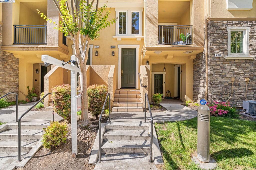 Huge price improvement! Step into comfort and style at The Courtyards at Dublin Ranch Villages! Only 1 FIGHT OF STAIRS TO MAIN LIVING AREA! This beautifully updated 2-bed, 2-bath condo boasts a designer kitchen with custom shaker cabinets, granite slab countertops, a gas range, stainless & black appliances, a roomy breakfast bar, and a walk-in pantry. Soak in the sunshine from not one, but two private balconies—perfect for morning coffee or evening relaxation. Enjoy the convenience of a main-level bedroom and full bath, while the spacious upstairs primary suite features a walk-in closet and dual-sink vanity. A dedicated laundry room adds storage, and the attached 2-car tandem garage offers interior access. For just $326/month, the HOA includes a resort-style pool, spa, clubhouse, and fitness center. Located across from Bray Commons Park with a playground, dog run, and open space, and just minutes from top-rated schools, shopping, BART, and I-580. This is East Bay living at its best!