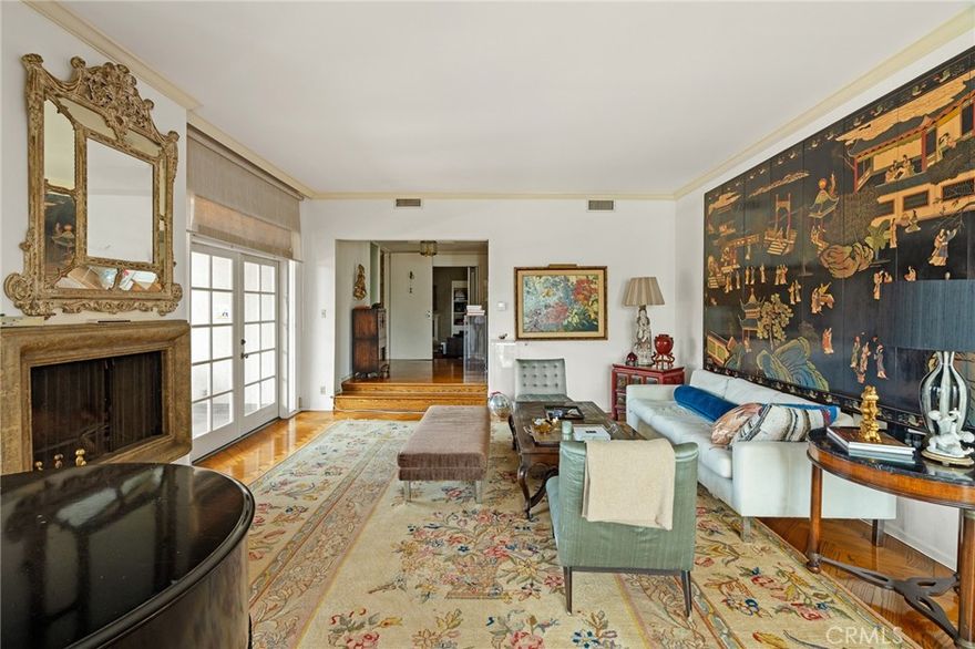 Experience refined living in this spacious 2-bedroom + den, 2.5-bathroom residence with no shared walls and direct elevator access to your private foyer. The expansive living room, enhanced by soaring ceilings and a fireplace, flows seamlessly into the dining area and breakfast nook, creating an inviting space for both entertaining and everyday living. The gourmet kitchen is a chef’s delight, featuring custom built-ins. Retreat to the grand primary suite, offering a cozy sitting area and a fireplace for added elegance. The secondary bedroom also features its own en-suite bath and overly sized walk-in closet, while the den provides flexibility as a home office or guest space. Enjoy the use of three dedicated parking spaces, and multiple balconies to take in the Beverly Hills scenery. All this, just moments from the world-class dining and shopping of Beverly Drive and Rodeo Drive.