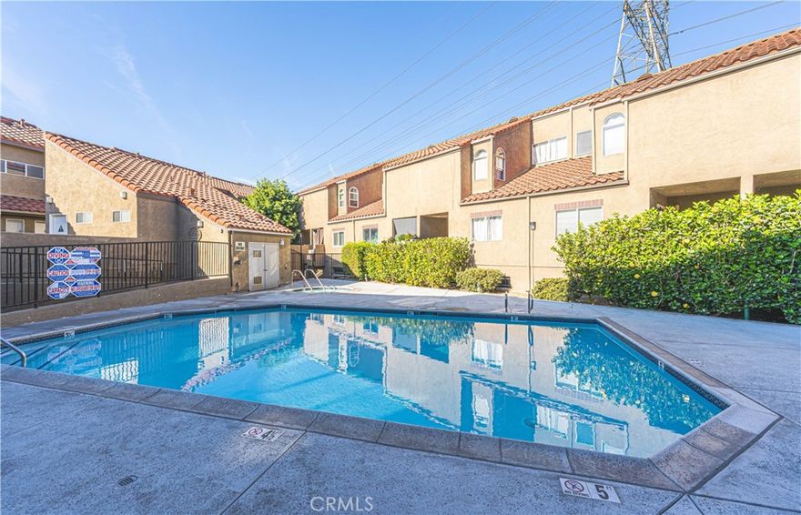 Approved for VA Financing! This beautifully remodeled townhome located in a gated ccommunity in the heart of Paramount offers a perfect blend of style and comfort, featuring modern light fixtures, stainless steel appliances, custom interior paint, elegant wood laminate flooring, and vaulted ceilings that create a spacious, airy feel. Dual-pane windows and sliders fill the home with natural light, while a large private outdoor patio balcony provides an ideal space for relaxing or entertaining. 

Recently renovated just a few years ago, the home also includes two subterranean parking spaces, low HOA dues, and access to a community pool and spa — making it a turnkey opportunity in a desirable location.

Be sure to check out hte 360° Virtual Tour and Call to schedule an appointment Today!
