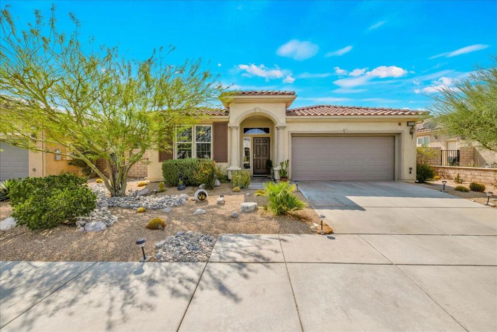 Welcome to Four Seasons, an exclusive 55+ gated enclave in Palm Springs that redefines resort-style living. Positioned as the most attractively priced home in the community, this elegant 3-bedroom, 2-bathroom residence offers approximately 1,900 square feet of refined interior space designed for comfort, ease, and enjoyment. High ceilings and an open floor plan create a light and airy ambiance, complemented by tile flooring, granite countertops, stainless steel appliances, and a generous center island--ideal for everyday living and entertaining alike. The large great room extends from the kitchen with additional tile flooring, a built-in gas fireplace and doorway leading to the beautifully secluded rear yard. The primary suite is a private retreat, complete with a customized walk-in closet and a spa-inspired bath featuring dual vanities and a walk-in shower. There's great separation of all bedrooms, plus a jetted tub in the second bath adding another layer of indulgence. Additional amenities include a dedicated laundry room, updated HVAC for year-round comfort, five new ceiling fans, and a 2-car garage with direct access. Beyond the interior, the rear yard unfolds as a tranquil haven--lush with mature landscaping, thoughtfully designed with artificial turf, and enhanced by multiple seating areas under a pergola-covered patio. Whether enjoying a quiet morning or gathering with guests, this outdoor space invites year-round enjoyment under the desert sky. At the heart of the community is The Lodge--a beautifully appointed clubhouse offering a curated calendar of social events, fitness and aerobics studios, ballroom, game room, library, and more. Residents also enjoy access to swimming pools, spas, tennis and pickleball courts, a BBQ pavilion, and scenic walking paths. This is a neighborhood designed for connection, wellness, and vibrant living. Located just minutes from downtown Palm Springs, fine dining, designer shopping, world-class entertainment, and top-tier medical care, Four Seasons offers both the serenity of a private community and the convenience of urban access. Low HOA dues include Frontier's fiber optic internet service. This is more than a home--it's an invitation to experience the Palm Springs lifestyle, tailored to those who expect more.