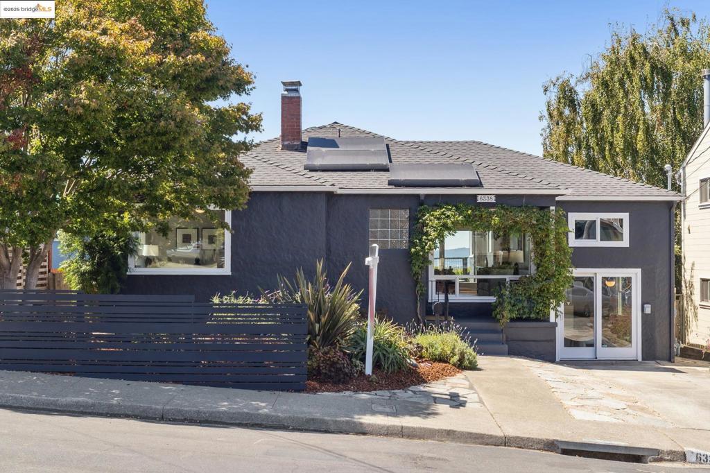 This home is full of surprises—the kind you’ll never forget. From the outside, you’d never guess the magic that unfolds once you step inside. The very first thing you see? The Golden Gate Bridge, SF City lights, & Bay Bridge– perfectly framed like a living work of art beyond sliding doors that open to an expansive deck. Inside, original charm meets modern comfort. A warm living room with a fireplace & built-ins sets the tone, while the dramatic dining room becomes the true centerpiece—dining here feels like eating against a backdrop of San Francisco’s skyline. The kitchen is both stylish & functional, with stainless steel appliances & a handcrafted bistro-height counter where you can sip coffee while soaking in the Bay. The 2 bedrooms are spacious with ample closet space, while the bathrooms look like they came straight from a design magazine—one with custom wood counters, curated finishes, & a handcrafted medicine cabinet that gives it unique character– the other with sweet honeycomb tile, with a classic, more modern vibe. Beyond the main floor, the home keeps unfolding. A cool loft space offers flexibility perfect for an office, studio, or play zone. Downstairs you'll find a bonus space, once an art studio. If that was not enough, there's a great yard too! So much to soak in!