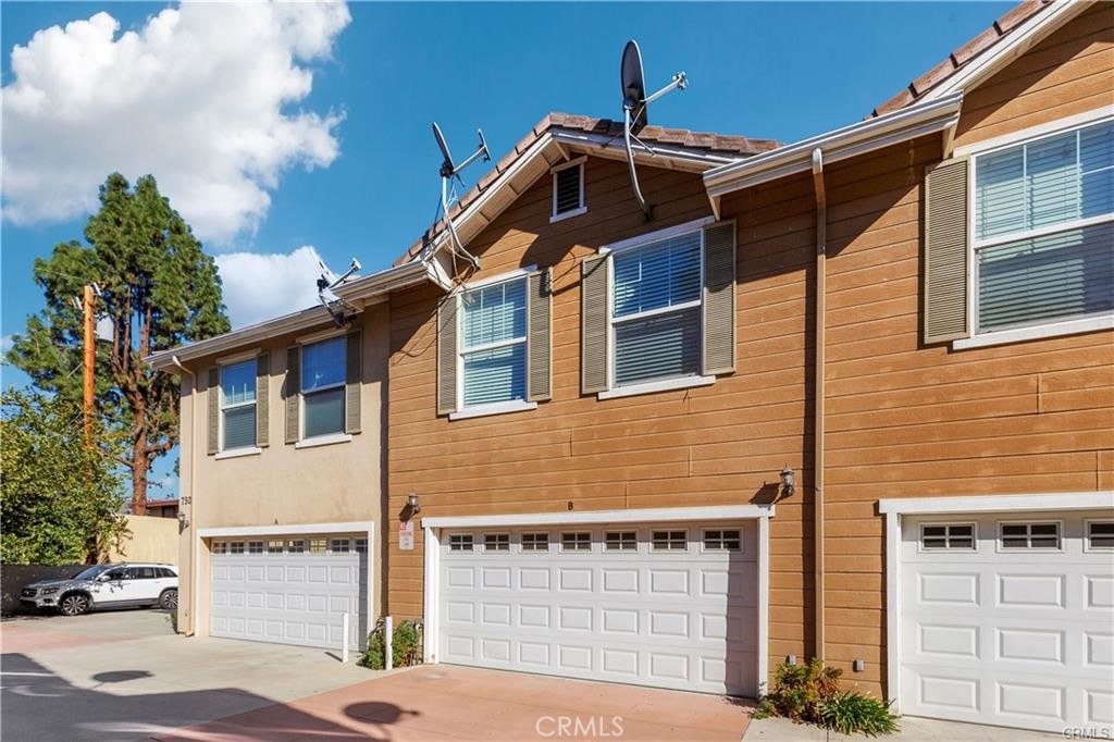 Tastefully remodeled, two-level townhome in gated community. Built in 2007, this remastered home boasts an open floor plan, 3 large bedrooms, 2.5 baths, 2-car attached garage. As you enter through the front door, you will encounter the living room with a cozy fireplace. New kitchen has quartz counter tops, elegant cabinetry with mosaic backsplash, and breakfast counter. Double french doors in dining room invite you to the front porch, perfect for entertaining. On the second floor, you are greeted with a spacious loft that can be a play, work, relaxation space or temporary guest quarters. Large master bedroom has walk-in closet with built-in organizers. Master bath has contemporary mosaic designs, dual-sink, a standing shower and separate tub. Second and third bedrooms are also large, with sliding glass mirror doors. Wood floors, classic baseboards, new electrical switches and much more. Neutral and inviting. Lease includes refrigerator, washer and dryer. Urban lifestyle with a small town feeling, the home is only minutes from Downtown Azusa, and borders the City of Covina. Also adjacent to schools, freeways, places of worship, bus stops, and shops. Come home to our your own oasis.