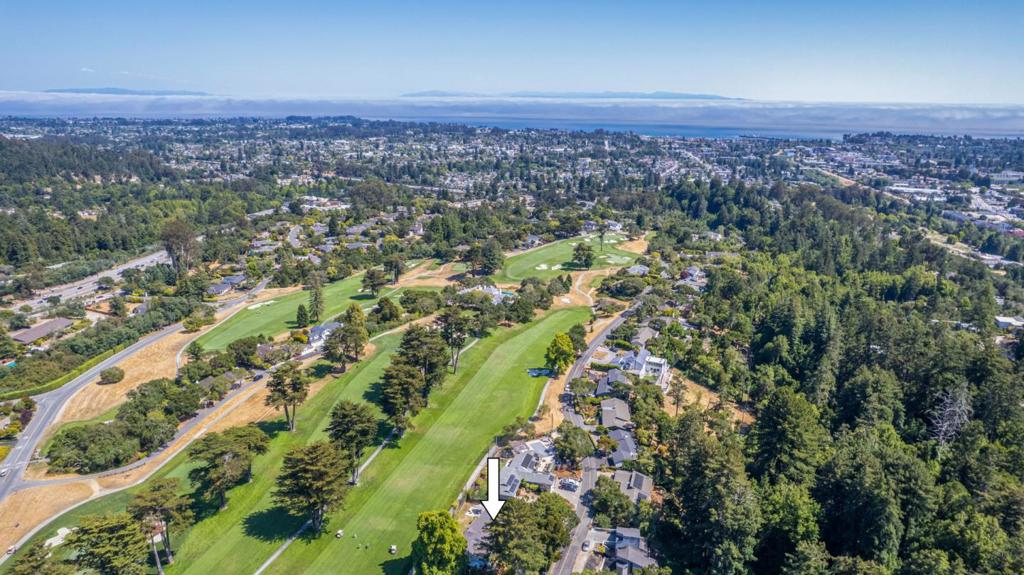 Located on the fairway within the sought-after and gated Pasatiempo golf community, home to the world-class Pasatiempo Golf Course. Once you arrive in this community with its majestic, oak-studded rolling hills and sunbelt weather, you will realize that you are home. When living in this desirable neighborhood, which features 2 restaurants, a community pool and tennis courts, you will feel comforted by the tranquil cocoon of the gated community surrounding you. This lovely single level home is situated on one of the less traveled, quieter streets in the community and features views of the golf course, a desirable floor plan with great separation of space, an updated chef's kitchen with a gas cooktop and a large pantry, a spacious living room with a cozy wood burning fireplace, a roomy dining room, newer windows throughout (installed 2018), partially updated bathrooms, bamboo flooring, brand new carpet, updated light fixtures, fresh interior paint, many storage closets, a circular driveway with room for 6 cars and an oversized 576 sf garage plus a walk up storage loft. If a second story was added to the home, there would be potential for ocean view. See it before it's gone!