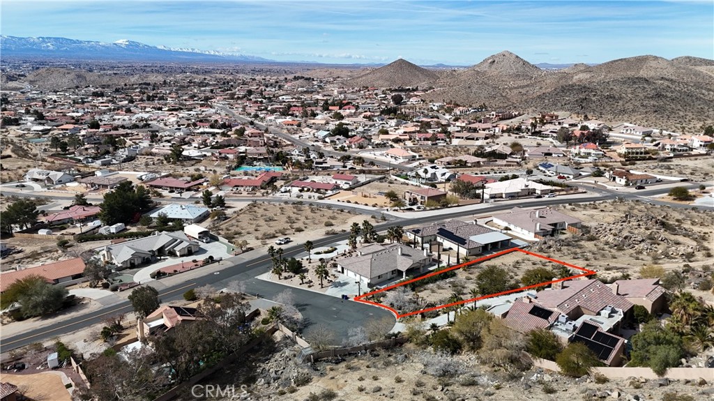 APPLE VALLEY - PRIME DESERT KNOLLS LOT - BUILD YOUR CUSTOM DREAM HOME! Welcome to you future home site! This exceptional find is a .45 +/- acre PANORAMIC VIEW lot nestled in a cul-de-sac, offering the perfect canvas for your custom-built home. Surrounded by beautiful, custom residences, this is your opportunity to join an established and desirable neighborhood. You'll be minutes from the St. Mary's Medical Center, the bustling professional corridor with its array of offices and services and have easy, quick access to the I-15. This is more than a piece of land; it's a foundation for your future. Don't miss this unique opportunity to build the home you've always envisioned in one of the High Desert's most desirable communities. Buyer to perform all due diligence to verify property is suitable for buyer's intended use.