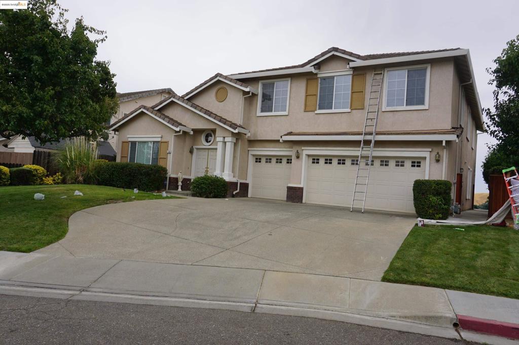 This is a spacious, comtemporay residence offering a luxurious feel with one of the largest floor plans in the community. The large Master Bedroomis downstairs. Privacy plus at the end of a quiet court which backs to the Antioch hills. The backyard offers an inground pool and spa with views of the hills. The home has solar, Upstairs there's a large bonus room with a wet bar. This home is an entertainers delight. Additional space for 7th bedroom upstairs