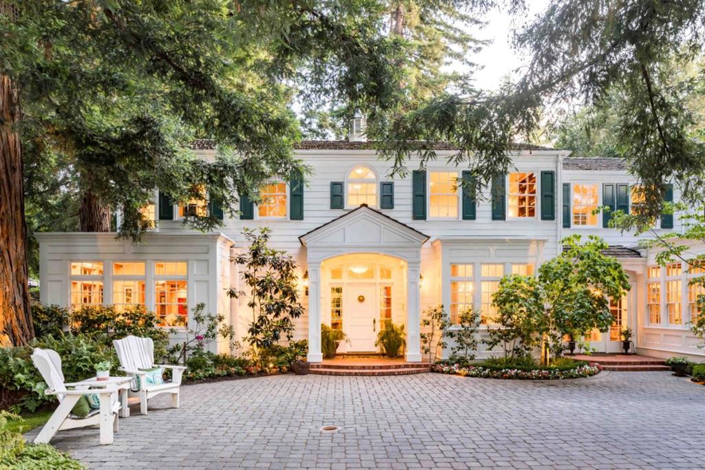 On a tree-canopied street in Central Menlo resides this stately 5-bedroom home, extensively rebuilt ~25 years ago and set on more than 6/10-AC. Feelings of warmth and hospitality envelop you from the moment you step through the front door, and incredible spaces both inside and out provide brilliant venues for both grand-scale entertaining and cozy nights at home. Expansive common areas, a chef's kitchen, convenient office, and a media room are just a few of the many highpoints this home provides, with over 7,400 sf adorned with hardwood floors, gorgeous millwork, and 2 stunning, antique French fireplaces both dating to the 19th century. Sprawling grounds beckon you with a wood-burning fireplace, lush lawn, pool, spa, and more. And though you may feel a sense of wonderful seclusion here, you will still be just blocks away from downtown Menlo Park, within walking distance of beautiful parks, and have access to the area's top public and private schools (buyer to verify eligibility).