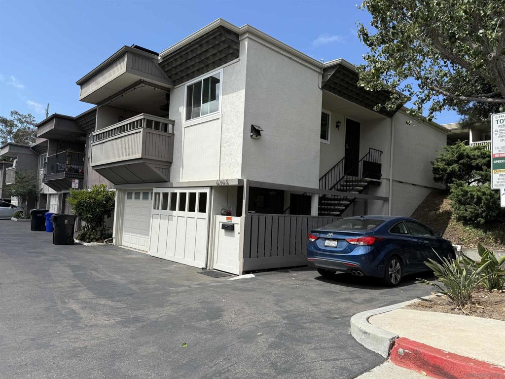 Condo is in cosmetic condition. Corner location townhome with city and sunset views. Nicely renovated main bathroom with large tub/shower. Upgrades include all new stainless appliances, solar, tankless water heater, water softner and reverse osmosis system and mini split AC and heat throughout the unit. Finished basement bedroom with a half bath. Recessed lighting throughout the unit. The parking area features a 1 car enclosed garage, 1 carport, 1 reserved parking space and an EV system to charge your vehicles. This is a must see and the best deal for next owner to add their personal touches. Close walk to USD.