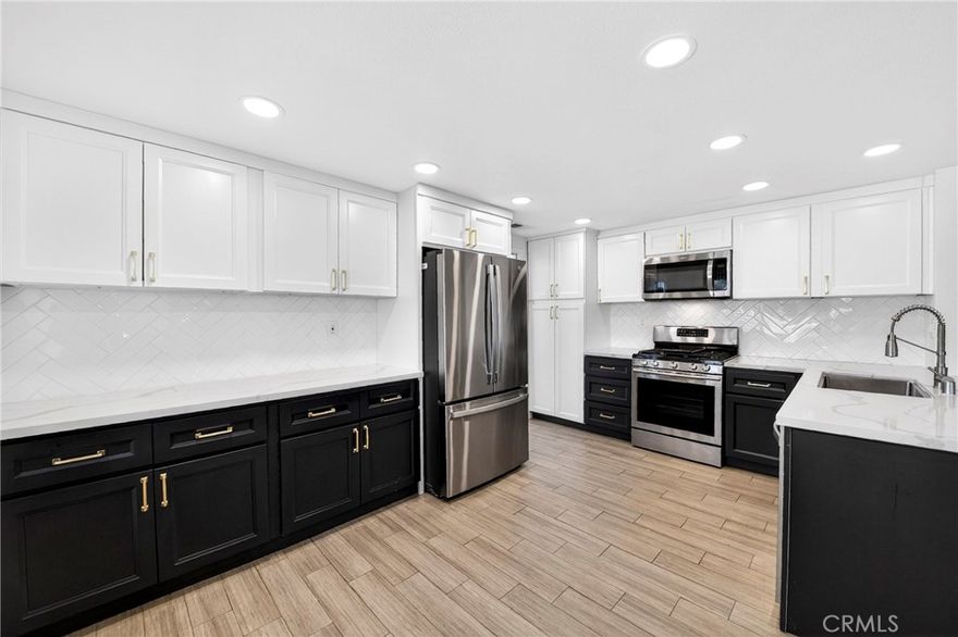 Welcome home to this fully remodeled home in “The Highlands” with 2216 sq ft of living space.  This 4 bedroom home has an attached 3 car garage and wide driveway for additional parking for 3 cars.  The downstairs level has 1 bedroom with french doors and a full bathroom.  This home comes equipped with a smart a/c, a fully updated kitchen, stainless steel appliances including refrigerator with granite countertops and wood floors.  The kitchen opens up to the family room with a gas fireplace.  There is a separate laundry room inside the home with washer and dryer hookup.  You can entertain in the formal dining area which opens up to the living room area.  Upstairs you will find 2 bedrooms with a fully remodeled Jack and Jill bathroom with dual sinks.  The primary bedroom has a large, fully redone bathroom with a separate tub, shower, dual sinks, and a large walk in closet.  The low maintenance backyard is perfect for entertaining and has views of the city and hills.  Move-in condition.