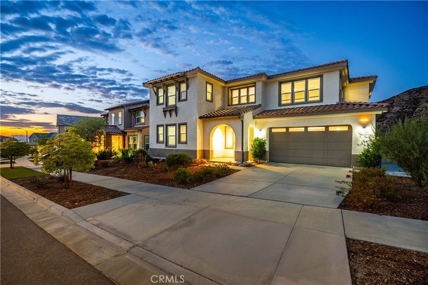 OMG! This is the ONE you’ve been searching for!



Exceptional corner residence in the prestigious, gated Aliento community of Canyon Country. This spacious executive home boasts nearly 3,500 sq ft of living space with 4 bedrooms, 3.5 bathrooms, a dedicated office, formal dining room, and a versatile upstairs loft - perfect for living and entertaining.



This home sits on the best lot in Aliento. Nestled against a majestic canyon with expansive views of the Santa Clarita Valley, it is truly a nature lover’s dream. Located near the Golden Valley Open Space, serenity surrounds you with only the sounds of nature. Deer and wildlife are often seen right from your windows, a property you must see to believe.



Step inside the grand entryway, where soaring ceilings open to the second floor, and your eyes are drawn to the stunning mountain view showcased through a 15-ft stacking sliding glass door. This seamless indoor-outdoor connection expands the great room to the backyard, highlighting your breathtaking setting. With only one neighboring home, privacy is unmatched.



The open floor plan is filled with natural light, featuring upgraded plank flooring downstairs and plush carpet upstairs. The chef’s kitchen offers a GE Café stainless steel appliance package with double ovens, granite countertops, custom roll-out cabinetry, under-cabinet lighting, and a walk-in pantry.



An upgraded open-tread staircase leads to the loft and wrap-around hallway. The luxurious primary suite showcases oversized windows to celebrate its premier location. The spa-like bath includes a marble-tiled shower with seat, soaking tub with marble deck surround, and a deep walk-in closet. Additional highlights: a downstairs office/bedroom with half bath, upstairs laundry with cabinetry, and a Jack-and-Jill bath with dual sinks.



Modern upgrades include Cat 6 wiring, flat-screen pre-plumbed in the great room and loft, LED recessed lighting, ceiling fans, ample storage, and owned solar grandfathered into NEM2.0 for incredible long-term savings. The 3-car tandem garage provides a sub-panel, 220V outlet for EV charging, plus an upgraded 8-ft rear garage door for backyard access.



The zeroscaped yard blends into panoramic canyon views for a low-maintenance outdoor lifestyle. As an Aliento resident, enjoy resort-style amenities: clubhouse, fitness center, pool, spa, parks, trails, and dog parks — all just steps from home.



Truly one of the best lots and most upgraded homes in Aliento!