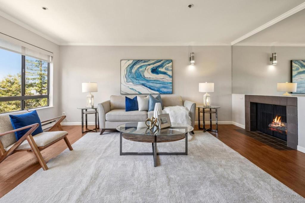 Discover refined modern comfort in this thoughtfully renovated home at 410 Sheridan Ave. This top-floor unit offers picturesque views of the foothills and seamlessly blends style, comfort, and convenience within a sought-after complex. Highlights include wood flooring, custom cabinetry, built-in appliances, natural stone countertops, and designer glass tile in the bathroom. The gourmet kitchen, adorned with white cabinets and stainless steel appliances, complements the convenience of in-unit stacked laundry. The primary bedroom features customized closets, while the dining area illuminated by a large window and a glass door opening to an airy balcony -- welcomes abundant natural light. Building amenities include an elevator, a heated swimming pool, a meeting room, and secure underground parking with assigned spaces. This prime location offers easy access to a year-round farmers market, top-rated dining, cafes, grocery stores, Caltrain, and Stanford University. Children may attend acclaimed schools such as Greene Middle and Palo Alto High (buyer to verify eligibility)
