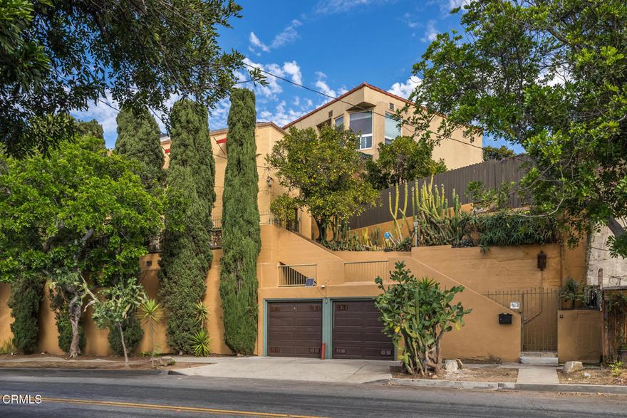 Welcome to Silver Lake! You'll be one block away from coffee, cocktails, dining and more, while also reveling in the tranquil surrounds of this magnificent 1925 character home. Take a role in the next chapter of this little slice of Los Angeles history, an address that has made cameos in films from 1930s noir to a modern-day rom com. Be delighted when you discover all the surprises beyond the street level gate and parking. Private patios, mature landscaping, smashing views, and pedigreed architectural details abound. Entertaining here will be unmatched. Enjoy preparing amazing meals with the classic O'Keefe and Merrit stove, or use the grill set up at the charming outdoor kitchen patio. This stately home provides all the craftsmanship of arts and crafts era designers, while at the same time providing a parcel size which allows for turnkey living when desired. The laundry nook and an outdoor sauna are tucked away for use as they are, or ripe for re-envisioning. Proof of this quintessential Los Angeles locale, from the privacy of your relaxing balcony, a view of the Hollywood sign and the Griffith Observatory in the distance! This is the perfect combination of access to fully cultured city living and retreat-style privacy. The zoning here allows multiple dwellings.