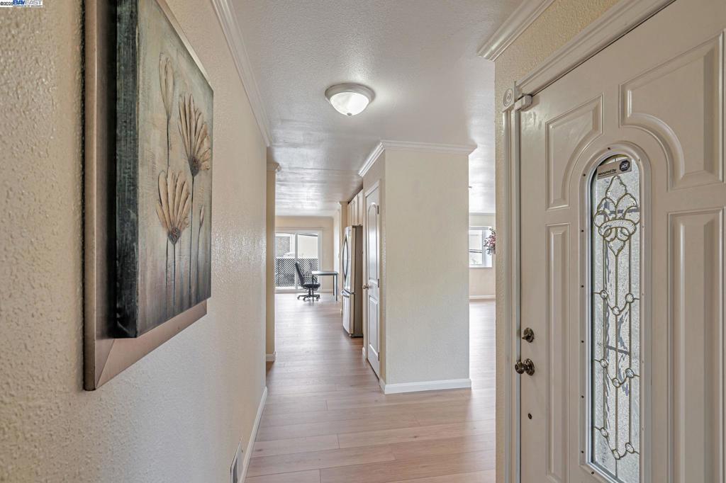 Attractive 2 bedrooms/2 baths LARGE condo conveniently located in San Leandro! Move-in ready home with NEW waterproof laminated wood flooring. The light-filled living room seamlessly flows into a cozy dining area and private balcony, creating the perfect space for entertaining. The updated kitchen features top to bottom cabinets, providing ample storage space for all your cooking needs. Both bedrooms are spacious and offer plenty of room for comfort and relaxation. Recessed lights and dual paned windows throughout. New patio door and in-unit side-by-side laundry for added convenience. Carport parking with extra storage. A commuter's dream with easy access to Oakland Airport, highway 880 and free transit transportation to SL BART station. Conveniently located near an Asian grocery stores, multiple restaurants, Marina Shopping Center and Kaiser Hospital, everything you need is just a short distance away. For outdoor enthusiasts, Marina Park is nearby, offering the perfect setting for leisurely walks or playing by the water. HOA covers all exterior, landscaping, garbage, water and sewer. Don't miss out this fantastic opportunity to own a great starter home or a wise investment! Come and see!!