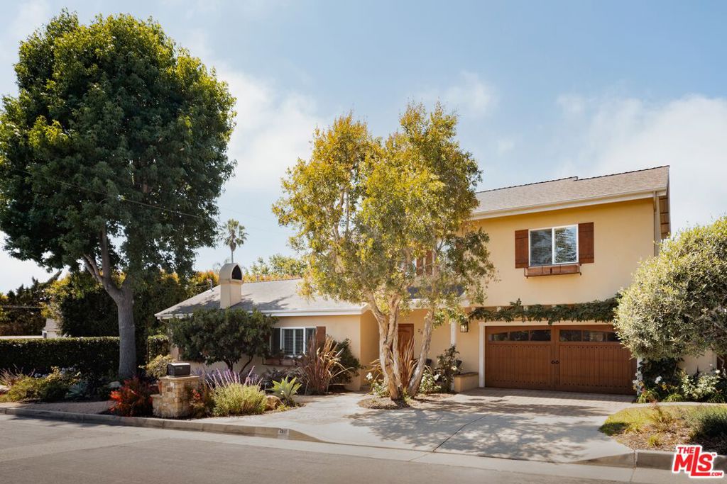 Tucked away on a tranquil cul-de-sac-like street, this bright-&-open two-story home offers spacious comfort and a rare sense of retreat all just a short stroll from charming De La Vina Street shops & restaurants, the Mission, and State Street. Recent upgrades to the nearly 2,000 sq ft home include new landscaping, new air conditioning with dual-zone smart controls, new lighting, updated appliances, and more! Considering its inviting floor plan and secluded outdoor space perfectly designed for relaxing and entertaining, you may find the hardest decision is whether to enjoy the comforts of home or explore the neighborhood.Step inside to discover soaring vaulted ceilings and open-concept living areas that flow seamlessly from living to dining to kitchen. The expansive yet cozy living room features a gas fireplace, and beautiful wood flooring throughout the home offers an elegant touch. The generous kitchen features a large central island, abundant storage and counter space, and a walk-in pantry. Just off the light-filled dining area, a private backyard and extensive flagstone patio invite effortless indoor-outdoor living -- whether you're relaxing in front of the outdoor fireplace, enjoying al fresco dining at sunset, or simply feeling the grass under your feet in the fully fenced side yard. A main level bedroom and full bath offer flexible options for hosting guests or creating a home office or studio. Upstairs, you'll find additional bedroom accommodations with plenty of natural light. The primary suite features vaulted ceilings, an en suite bathroom, a spacious walk-in closet, and a private mountain-view balcony. Additional storage areas on the main level and an attached 2-car garage with a dedicated laundry area complete the home's convenient amenities. Beautifully balancing comfort, privacy, and close-to-town convenience, this charming home captures the essence of Santa Barbara living. Located in the desirable Peabody Elementary School attendance area and mere minutes from beloved spots like Handlebar Coffee, Los Agaves, and the Natural History Museum, it's a welcoming retreat ready for its next chapter!