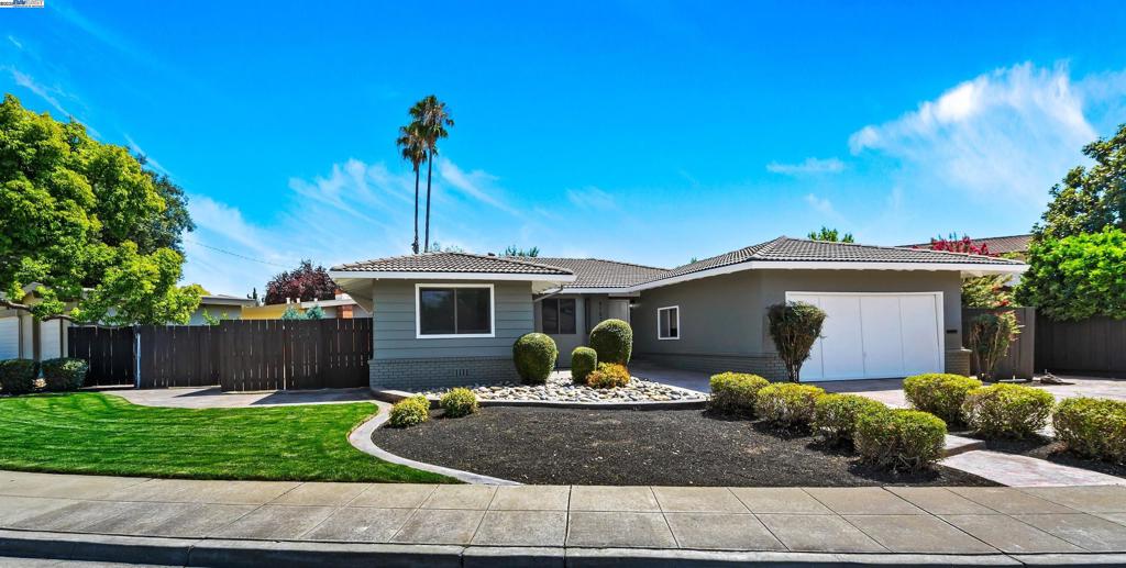 RARE ONE OWNER HOME in a highly desirable inner neighborhood location!! From the moment you arrive you will appreciate the well maintained neighborhood with NO HOA and expansive front yard featuring a NORTH-FACING front door, new exterior paint, and oversized stamped concrete driveway. Step inside to see the stunning solid oak hardwood floors and spacious and bright interior featuring recessed LED lighting, new carpet, new two toned paint, new baseboards and dual paned windows and sliders. The spacious eat-in kitchen is equipped with solid wood cabinetry with custom pull-out drawers, and opens to the family room with a cozy wood-burning fireplace, bay window and large slider. Primary suite offers double cedar lined closets and an en-suite full bathroom. Step outside to the expansive backyard with custom deck and pergola, storage shed and HUGE SIDE YARD ACCESS with plenty of room for a pool or ADU! Unbeatable location within walking distance to nearby schools, parks, downtown Livermore, and the area’s renowned wineries and breweries. MUST SEE!!!