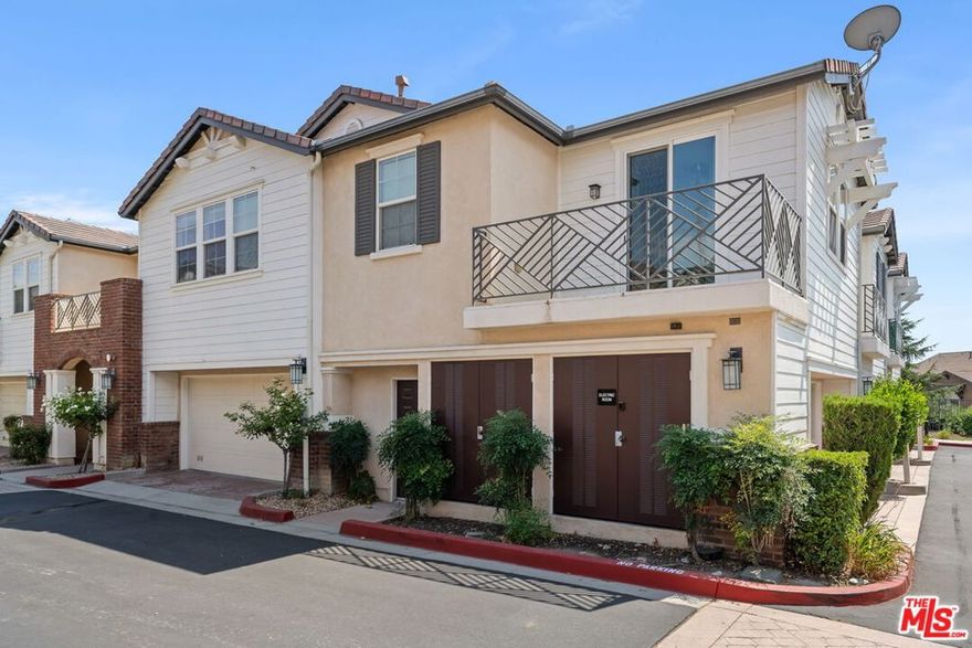 Peacefully tucked into the foothills of Rancho Cascades (Sylmar area), this Legends at Cascades condo offers mountain views, natural light, and a calm, serene setting. Hardwood floors run throughout the home with tile in the bathrooms, and multiple balconies provide space to enjoy the scenery. Open living room and dining area combination for relaxed living. The kitchen is equipped with custom wood cabinets, stone countertops, stainless steel appliances, including a refrigerator with water-line, ice maker, and dishwasher. A shoe closet is conveniently located near the entry staircase. The primary bedroom features an en suite bath with an expansive walk-in closet and opens to a private terrace. The second bedroom includes a generous closet of its own. Additional highlights include in-unit laundry and a private two-car garage with an electric vehicle charger. Community amenities include a pool, spa, BBQ, and playground, all within a dedicated, secure area. With shopping, dining, and freeway access just minutes away, this home provides all of life's necessities and comforts.