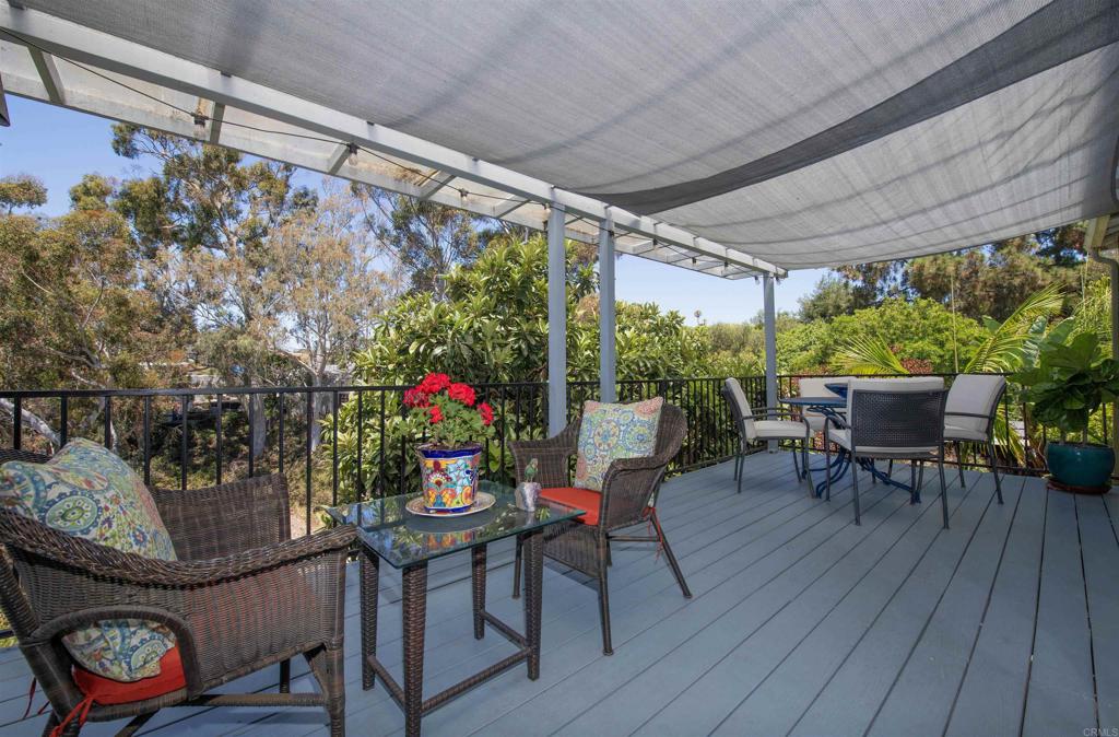 Tucked away in the heart of University Heights, this one-of-a-kind canyon retreat feels like a private treehouse. Set back from the street, you’ll follow a peaceful pathway to the front door. Two private expansive decks with stunning canyon views one off the main living area and one off the master. Inside enjoy the beautiful hardwood floors and a charming spiral staircase connects the living spaces, all surrounded by lush greenery and serene vibes. One car garage and your own private parking/patio area. Quiet, private, and truly special—this is canyon living at its finest.