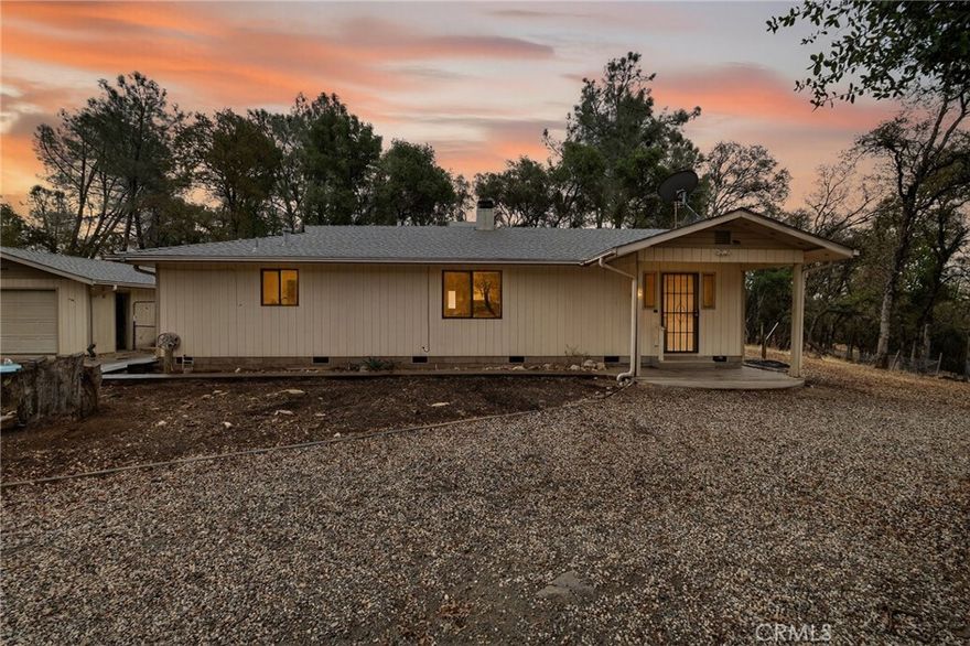 A Homesteader’s dream awaits on 7 acres! This fully fenced property features a spacious 1,536 sq. ft , 2 bedroom 2 bath home with a detached 2 car garage and 1-car carport . The home is just waiting for someone to update it and create a beautiful homestead. Property highlights include four wells, two large greenhouses for year round gardening, and chicken coops with nest boxes. A fully fenced area is set up perfectly for multiple goats, complete with goat houses and a quarantine shelter.With everything in place for gardening , chickens, and goats, this property is ready for someone with a vision!