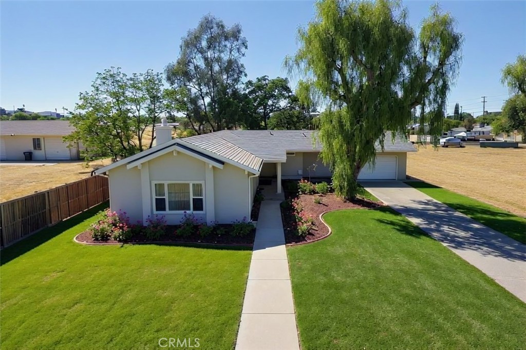 Welcome Home to this awesome 3 bedroom, 2 bath, 1792 sqft house on over 1.5 acres. Walk into this super open floor plan with the family room and kitchen open to each other, perfect for entertaining or just cozy up in front of the cozy fireplace. To the left on the house, you have a huge bedroom with vaulted ceilings and tons of natural lighting through the large windows. To the back of the home, you have the master bedroom with its own master bathroom and walk in closet as well as a very large secondary bedroom, also with vaulted ceilings as well as an additional full bathroom. This home sits on 1.57 acres with tons of potential!! Bring all your toys!! Or, use it as a great investment opportunity and split the lot and build additional homes. There is a tentative lot split map available in the event that you'd like to split the property and build 5 additional homes. Great investment opportunity!!! Call today for a private showing!! ****Professional pictures and virtual tour coming soon!