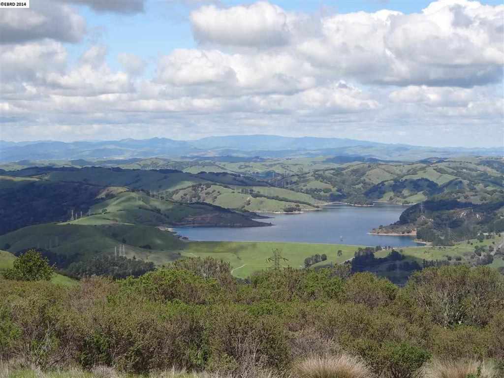 Near the summit of Grizzly Peak, this secluded two acre parcel has sweeping views of the San Pablo Reservoir. Private unpaved & unmarked lane off Lomas Cantadas with electricity and telephone accessibility. Low density residential zoning may be un-buildable; other agricultural uses may be permitted.