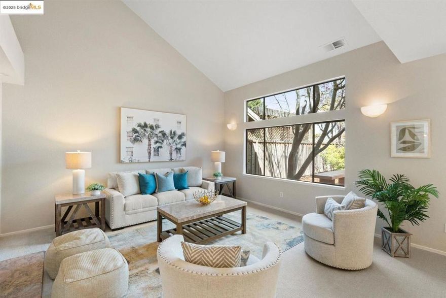 Nestled in a gated community on Alameda’s Bay Farm Island, this spacious 3-bedroom, 3-bathroom home was thoughtfully designed for dreamy indoor/outdoor living, natural light and privacy. Follow the sunny path from the two-car garage into 167 Purcell, a duet that lives like a single-family home. A bamboo-floored hallway connects living, dining, and kitchen areas as well as a ground-floor bedroom and full bath/laundry room. Abundant natural light fills the living room and dining area, thanks to a wall of windows and patio door that leads to an expansive deck. The fenced garden is a green thumb's delight, with flowering trees, a Japanese maple, and mature lemon tree. Homemade lemonade and summer BBQs await! Chefs will enjoy the kitchen’s quartz countertops, brand new refrigerator, and location between the dining room and sun-drenched breakfast nook that make both dining and cleaning a breeze. Upstairs, the freshly carpeted primary bedroom offers a retreat with a balcony overlooking the garden. Both upstairs bedrooms include full, en-suite bathrooms with double sinks. There's lots of closet and storage space throughout the home, including a garage attic space. The complex has a community pool.