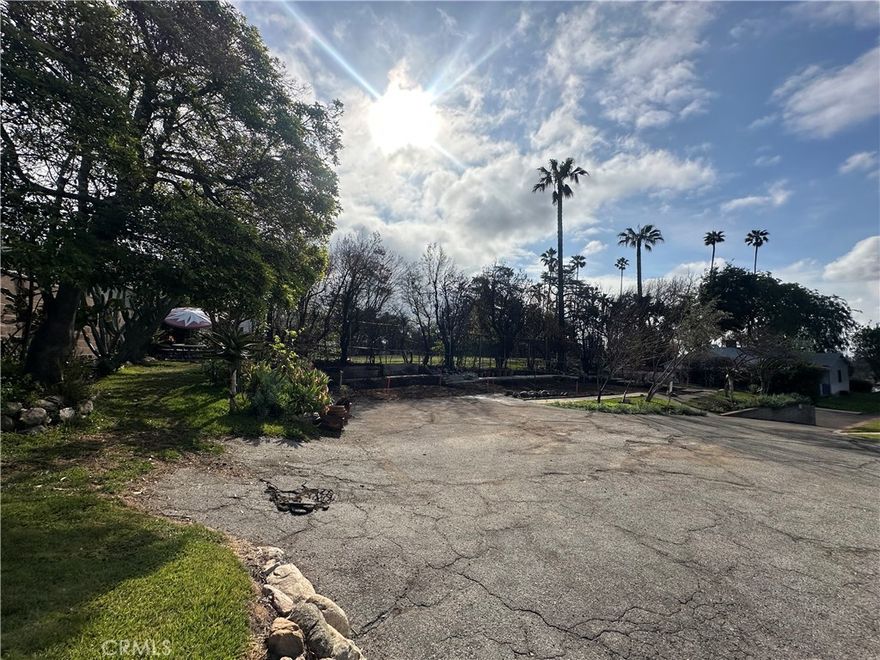 Price improvement: Now offered at $400,000, this 5,500 sq ft lot at 1003 E Mariposa St is set back from the street with easement access, offering privacy and a peaceful setting just minutes from the center of Altadena. The land has been fully cleared through certified Phase I and Phase II post-fire cleanup and is ready for new construction. Zoned LCR2YY, the property may allow for a single-family residence or potentially two units, such as a main home with an additional unit (buyer to verify with the county). The lot formerly hosted a 2-bedroom, 1-bath home of approximately 845 sq ft with a detached garage. All utilities were previously connected and are available at the street (buyer to verify availability and reconnection requirements). The lot is rectangular and privately situated beyond the street. Buyers and builders might be able to take advantage of L.A. County’s post-fire pre-approved plan and AI-assisted permitting program, enabling faster approvals and reduced design costs. Opportunities for new development in this area are limited, and the surrounding neighborhood has seen increased interest in redevelopment. Note: Any home rendering image shown is AI-generated for illustrative purposes only and may not reflect actual plans or buildable features. All information is deemed reliable but not guaranteed. Buyer to independently verify zoning, building regulations, and all aspects of property development with the appropriate local authorities.