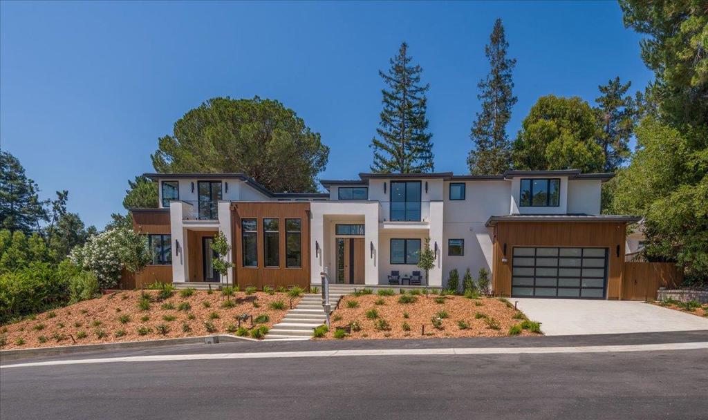 Exceptional Modern Contemporary Luxury Home in Sharon Heights. Welcome to this stunning new construction, ideally located on one of the most sought-after streets in Sharon Heights. This modern contemporary showpiece offers approximately 5,327 sq ft of thoughtfully designed living space on a 15,649 sq ft lot, plus 435 sq ft of garage space. Every inch of this home reflects exceptional craftsmanship, elegant design, and luxury finishes.The dramatic grand foyer sets the tone, boasting soaring ceilings and clean architectural lines. It opens to a formal living room and an elegant dining area accentuated by a striking wine display gallery. At the heart of the home is the expansive kitchenfamily great room, perfect for everyday luxury and entertaining. It features a large center island, Wolf and Sub-Zero appliances, and a discreet walk-in pantry. Bedroom Suites: The home offers 6 spacious en-suite bedrooms and one half bath, providing both privacy and comfort. Main Level: One generously sized en-suite bedroom. A fully equipped ADU with a private bedroom suite and sitting area, ideal for guests, extended family, a home gym, or a playroom. Upper Level: Four additional en-suite bedrooms, including a lavish primary suite. Three of the upstairs bedrooms feature private balconies.