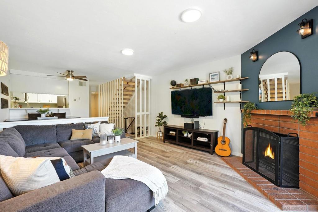 Tucked away in a secure gated community in the heart of the College Area, this beautifully updated townhome offers a perfect blend of comfort, character, and functionality across three thoughtfully designed levels. The main floor is made for entertaining, featuring a bright and modern kitchen, a dedicated dining area, a cozy living room with a fireplace, and a convenient powder room. Upstairs, you'll find a spacious primary suite and a generously sized guest bedroom with its own full bath. The lower level provides a versatile bonus space with a large laundry/storage area, ideal for keeping your home organized. Enjoy the privacy of your own front yard and a spacious balcony overlooking the landscape, plus the ease of an attached 1-car garage and a separate assigned parking space. With low HOA fees covering water, trash service, landscaping, and common area maintenance, this home offers incredible value. The complex is both VA and FHA approved - and best of all, the property comes with an assumable VA loan at a 3.875% interest rate. This location is centrally located in San Diego with easy access to I-8 and HW-94. A short drive to downtown, the airport, Target, Sprouts, Trader Joes, Walmart, Mission and Fashion Valley Malls, and so much more. SDSU is just minutes away, and University Ave and El Cajon Blvd offer many restaurants and coffee shops right around the corner.