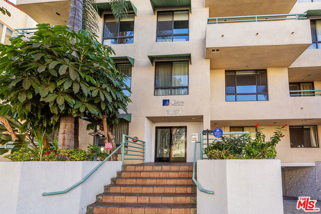 Beautifully maintained front-facing condominium featuring 2 bedrooms and 2.5 bathrooms, located in a prestigious, well-kept complex in the heart of Westwood. This inviting residence boasts a gracious layout with a spacious living and dining area, complete with coffered ceilings, a wet bar, fireplace, and a front-facing balcony offering tranquil treetop views perfect for enjoying the outdoors. The thoughtfully designed floor plan features a central hallway and two generously sized bedrooms, each with its own en-suite bathroom. A convenient side-by-side laundry area is also included. The large kitchen offers granite countertops, ample cabinetry, double oven, cooktop, microwave, and dishwasher ideal for home cooking and entertaining. The expansive primary suite features a fireplace, walk-in closet, dual vanity, and separate shower. Additional highlights include crown molding, abundant closet space, fully tiled bathrooms and kitchen for easy maintenance, and two-car gated parking with guest spaces. Situated within the desirable Westwood Charter School District, this well-managed building with HOA which includes earthquake insurance. Prime Westwood location, just minutes from Century City Mall, UCLA, Holmby Hills, Beverly Hills, Rancho Park, Brentwood, and Santa Monica. Easy access to premier shopping, dining, and major freeways (10 & 405) makes this a truly exceptional offering.