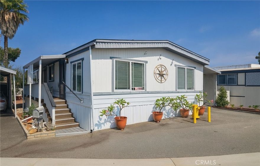 Situated in the desirable 55+ community of Belmont Shores Mobile Estates, this double wide home offers two bedrooms and two full bathrooms across approximately 1,000 square feet of single level living space. The open layout provides an abundance of natural light and comfortable living areas throughout. The home has been touched with fresh exterior trim painting, and upgrades to the front porch handrail and steps.



Belmont Shore Mobile Estates features resort style amenities including a heated pool, spa, fitness center, clubhouse, library, and walking paths overlooking the marina. This gated community provides 24-hour security and a peaceful coastal setting close to shopping, dining, and the beaches of Belmont Shore and Seal Beach.