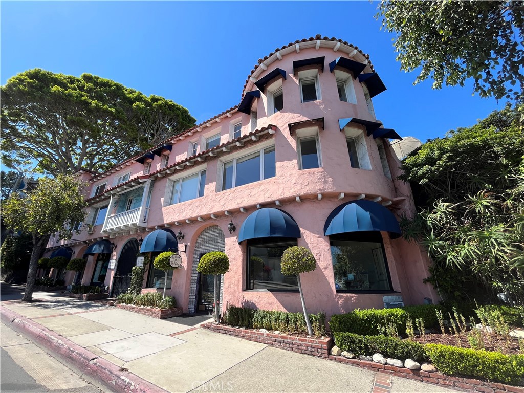 This spacious apartment includes a separate office/den area and is located in a charming old-school European-style building, nestled in Laguna just steps from the beach, downtown shops, and restaurants. The layout offers more than a traditional one-bedroom, thanks to the additional office/den space. Recently remodeled, the unit features new kitchen cabinets, granite countertops, stainless steel appliances, a new granite vanity in the bathroom, fresh paint throughout, and refinished hardwood floors.The building boasts incredible grounds and community courtyards, providing a serene sanctuary to relax and unwind. The building is privately gated, ensuring privacy and security. Laundry on-site. *DOES NOT COME FURNISHED