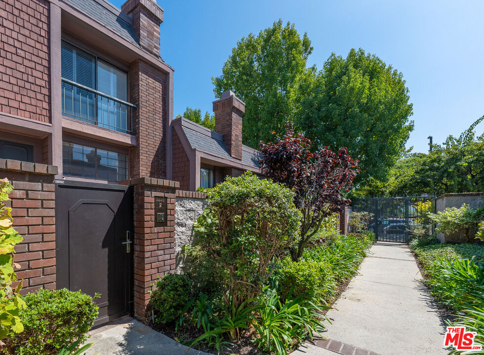Centrally located in the heart of Marina Del Rey, this spacious 3BR/2.5BA townhome offers 1,707 sq ft of comfortable living in the highly sought-after gated community of Villa Vallarta. A private front courtyard with lush greenery welcomes you inside, where a freshly painted split-level floor plan features a bright living room with soaring two-story ceilings and a cozy fireplace. The next level includes a well-appointed kitchen with granite countertops, white cabinetry, gas range, wall oven, new refrigerator and dishwasher, plus an adjoining dining area with a wet bar. A laundry room with full size washer and dryer is conveniently attached. Upstairs, the primary suite boasts hardwood floors, generous closet space, and an en suite bath with a soaking tub, separate shower, and dual vanity. Two additional bedrooms with hardwood flooring and a shared full bath complete the top floor.Additional highlights include an attached two-car garage, guest parking, a first-level powder room, and access to the community pool and spa. Ideally located across from Glen Alla Park and minutes from beaches, shops, restaurants, Trader Joe's, and the marina.