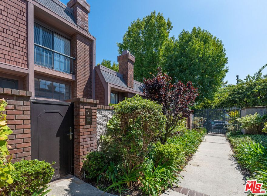 Centrally located in the heart of Marina Del Rey, this spacious 3BR/2.5BA townhome offers 1,707 sq ft of comfortable living in the highly sought-after gated community of Villa Vallarta. A private front courtyard with lush greenery welcomes you inside, where a freshly painted split-level floor plan features a bright living room with soaring two-story ceilings and a cozy fireplace. The next level includes a well-appointed kitchen with granite countertops, white cabinetry, gas range, wall oven, new refrigerator and dishwasher, plus an adjoining dining area with a wet bar. A laundry room with full size washer and dryer is conveniently attached. Upstairs, the primary suite boasts hardwood floors, generous closet space, and an en suite bath with a soaking tub, separate shower, and dual vanity. Two additional bedrooms with hardwood flooring and a shared full bath complete the top floor.Additional highlights include an attached two-car garage, guest parking, a first-level powder room, and access to the community pool and spa. Ideally located across from Glen Alla Park and minutes from beaches, shops, restaurants, Trader Joe's, and the marina.