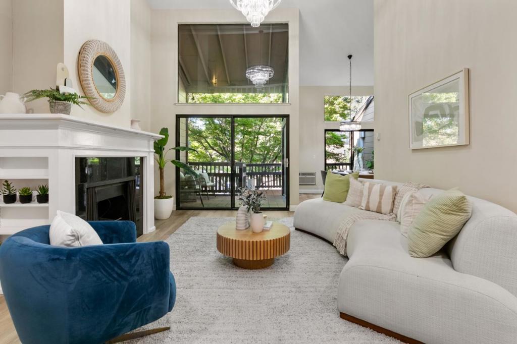 Welcome to this spacious and beautifully updated 1,884 sq. ft. home in a quiet, tree-lined Mountain View community. With 3 bedrooms and 3 baths, including a rare dual-primary setup, it offers both comfort and flexibility. The main level features 2 bedrooms and 2 baths, while the upper level includes a private suite and loft, perfect for a home office. The bright living room boasts soaring ceilings, oversized windows, and a cozy fireplace. Three sliding glass doors lead to a shaded deck for seamless indoor-outdoor living. Enjoy a remodeled kitchen with quartz countertops, stainless steel appliances, and quality cabinetry, plus new flooring and plush carpet throughout. Additional features include indoor laundry, solar panels, and an HOA that covers water, hot water, sewer, and more. Ideally located in Mountain View near shopping, dining, major freeways, and top-rated Los Altos High School, this home offers the perfect blend of space, style, and convenience.