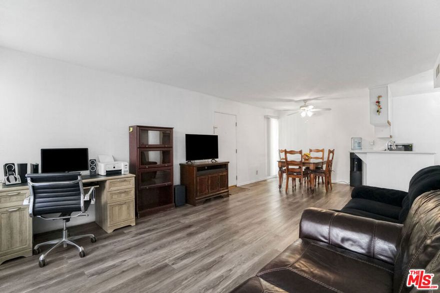 MOTIVATED SELLER - Bring all your offers! Welcome to Unit #156 at the Westside Condominiums a 2-bedroom, 1-bath condo in original condition, ready for your personal touch. Ideal for a renovation project or rental income, this unit offers a functional layout and a private covered balcony. Please note: the AC is not working.Located in a gated community with a pool, 3 spas, clubhouse, and a park right across the street. Convenient to shopping, dining, Topanga Mall, The Village, and Pierce College. HOA covers water, gas, trash, and sewer. Don't miss this value-add opportunityschedule your showing today!