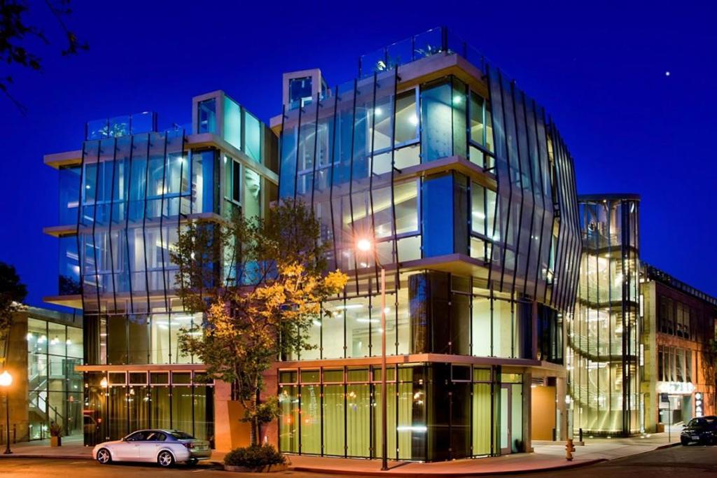 This is a collection of three residential condos APNs 120-73-001, 120-73-002, and 120-73-003 connected by a private common area and sold together as a compound. Perched above the city with sweeping views from downtown Palo Alto to the Santa Cruz Mountains, this architectural triumph known as "The Castle in the Sky" is a true one-of-one. Designed in 2012 by Bellomo Architects as the architect's personal residence, this slag-based concrete compound offers unmatched rarity, security, and exclusivity. Set atop a two-story commercial building and the only residential use in the area, this private enclave offers 17,000 sf of exclusive use space featuring three impeccably designed condos. Each offers 2 bedrooms, 2.5 baths, private balconies, and expansive 1,000 sq ft rooftop gardens with 3 feet of soil for true outdoor living. Fleetwood floor-to-ceiling windows, radiant hydronic heating/cooling, and floating staircases create a seamless, sophisticated design. Multiple layers of controlled access and an 8-vehicle subterranean garage with car elevator ensure protection and discretion. Tucked in the heart of Palo Alto, this hidden fortress above the city provides total seclusion with immediate proximity to the world's most influential tech and business hub.