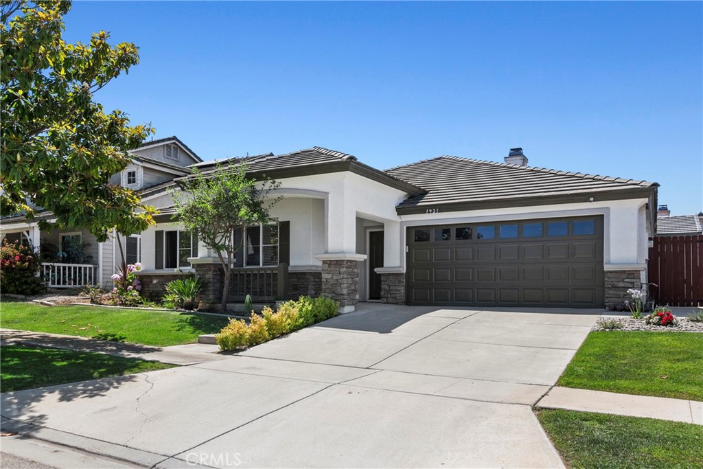 Welcome to an extraordinary real estate opportunity in Santa Maria, CA, where you get two homes for the price of one! This sophisticated property is a modern living masterpiece designed to offer both comfort and value.
The main residence unfolds over 1,700 square feet of meticulously designed space. It features an innovative floor plan with the master bedroom strategically set apart from the three additional generous bedrooms, ensuring maximum privacy and serenity. With two sleek, contemporary bathrooms and dramatic high vaulted ceilings, the home exudes an atmosphere of comfort and style.
Eco-conscious homeowners will appreciate the Tesla charger installed in the garage, making electric vehicle charging a breeze. As a special bonus, the seller is including all furniture at no extra cost, ensuring a seamless and move-in-ready experience.
The property also features a newly constructed 749 square foot Additional Dwelling Unit (ADU), elevating this offering to new heights. This 2-bedroom, 1-bath unit dazzles with modern aesthetics, tile floors, brand new cabinets, and a sleek stove—ideal for guests, extended family, or rental income opportunities.