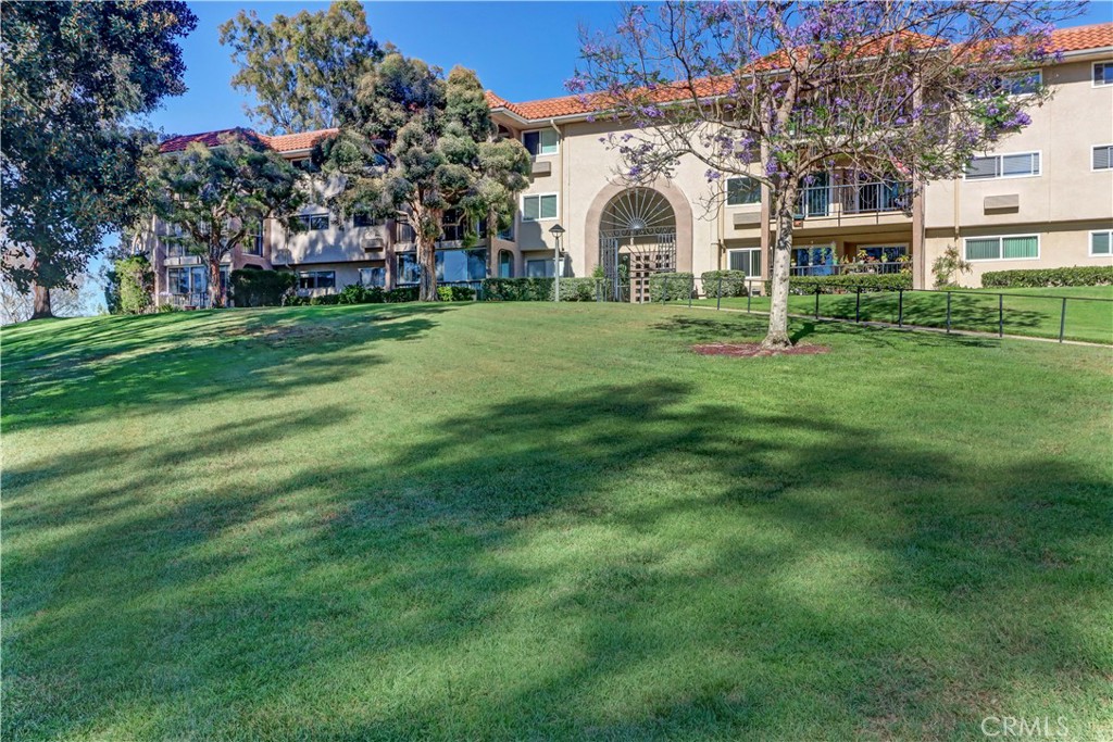 Views, Views, Views - this beautifully remodeled Villa Puerta (1BR/1BA) is located in Laguna Woods Village- the premiere 55+ active community in Orange County and just minutes away from Laguna Beach. This exceptional hilltop location offers cool evening breezes and city lights at night. As you enter the home you are greeted with this panoramic view from your spacious balcony. This view can be enjoyed from both your expansive living room and dining room. The living room is showcased by a large custom built wall unit. The kitchen is updated with stainless steel appliances, new cabinets, quartz countertops and recessed lighting. Your bedroom is oversized with a custom built open closet concept. There are built-in drawers, open shelving and space to hang your clothing. The bathroom has been remodeled with a walk-in shower, new vanity and recessed lighting. Other great features include double paned windows, shutters, ceiling fans, and smooth ceilings. New carpet was recently installed and the home was painted throughout making your new home move-in ready. Come and see this beautiful home and enjoy all the amenities of Laguna Woods Village such as: 27-hole golf course plus a 9-hole par 3 course, separate pickle ball courts, tennis courts, five swimming pools, three fitness centers, seven clubhouses including Clubhouse 4 offering amazing classes in art, ceramics, woodshop, jewelry-making, sewing, and much more. The home is just a few steps away from the elevator and community laundry room . Parking is subterranean….no steps necessary to access your home on the second floor.