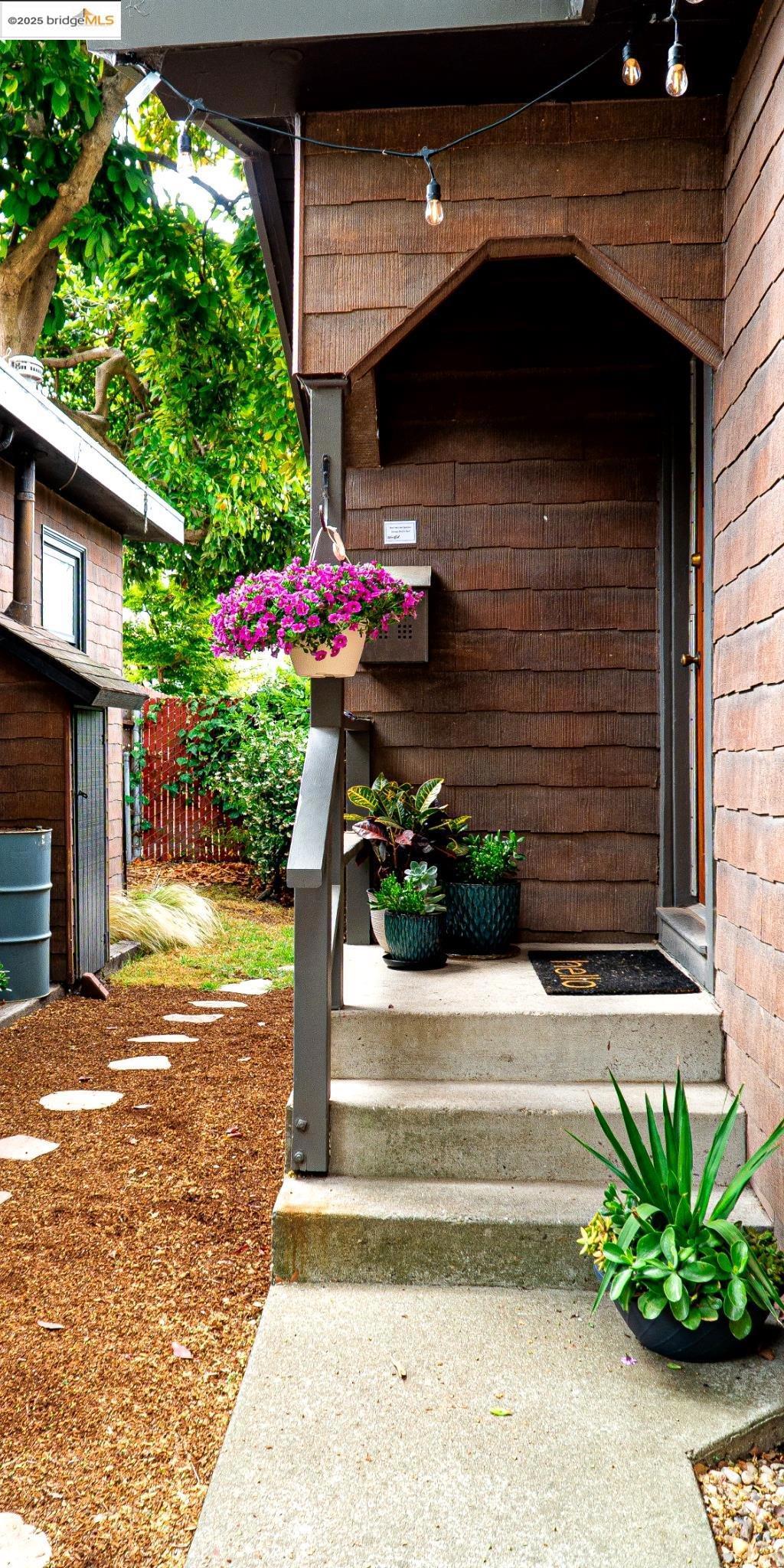 Vintage Charm Meets Modern Simplicity — A Unique Berkeley Cottage Tucked away in a serene 5-cottage community, this freestanding 1-bedroom home offers the rare blend of historic character, privacy, and ultra-low-maintenance living. Originally built in 1919 as part of a charming auto court, this petite gem is now part of a small condo association—but lives like a single-family home. No shared walls, no upstairs neighbors—just your own peaceful retreat in a lush garden setting. A cozy front porch welcomes you inside, where warm wood tones, clean lines, and timeless finishes create a sense of calm and character. Step outside into your private yard, a true extension of the living space. Enjoy morning coffee or summer evenings under twinkle lights, with space for lounging, gardening, or entertaining. There’s even a detached shed for extra storage or creative use. Whether you're a first-time buyer, downsizer, or minimalist seeking a peaceful base in the heart of Berkeley, this cottage offers soulful living with maximum independence and minimum fuss. ~https://www.DerbyStCottage.com/mls/176693806