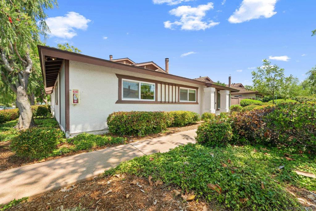 Welcome to 9851 Caminito Cuadro, a bright and private single-level townhome located in a quiet, well-kept community. With only one attached wall and an attached private garage, this home offers the comfort and privacy of detached living. Inside, the open living area is filled with natural light and features a cozy fireplace in the living room. The kitchen includes an oven, refrigerator, and microwave, and the unit also comes with a stacked washer and dryer for your convenience. The layout is all on one level with no interior stairs. Enjoy indoor-outdoor living with a private, fenced patio and yard — perfect for barbecuing or relaxing in the sun. Just across from the community pool, this home is ideally situated for easy access to recreation while maintaining peace and quiet. Quick access to both the 56 and 15 freeways makes commuting simple. Basic cable, internet, water, trash, and sewer are all paid by the landlord. No Airbnb or short-term rentals are allowed. Pets are negotiable, and smoking is not permitted on the property.