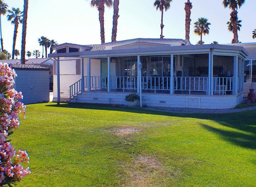 WOW! This upgraded 1994 Park Model is Gorgeous. Park Model has a Green Belt to the 1 side and Golf Course at the rear with views of the 1st & 10th holes. The San Jacinta Mtns are in the Background and a lake in the foreground. Sunsets are gorgeous from your wrap around deck with Auto Scrrens and also Auto Shutters to close the deck down from the weather. Entering into the unit, the first thing you''ll notice is how open it is and the views outside. The Kitchen offers Corian Counters, Stainless Steel Fridge & Cook-top, D/W and Microwave. Art niches and hidden lighting on top of the cabinetry. The bathroom has a corner shower and is a Jack & Jill. Lots of windows throughout. The unit has Mini Split A/C units with 2 heads, The exterior shed offers a Stackable W/D, and shelving. The pictures tell you about this awesome place. It won''t last.